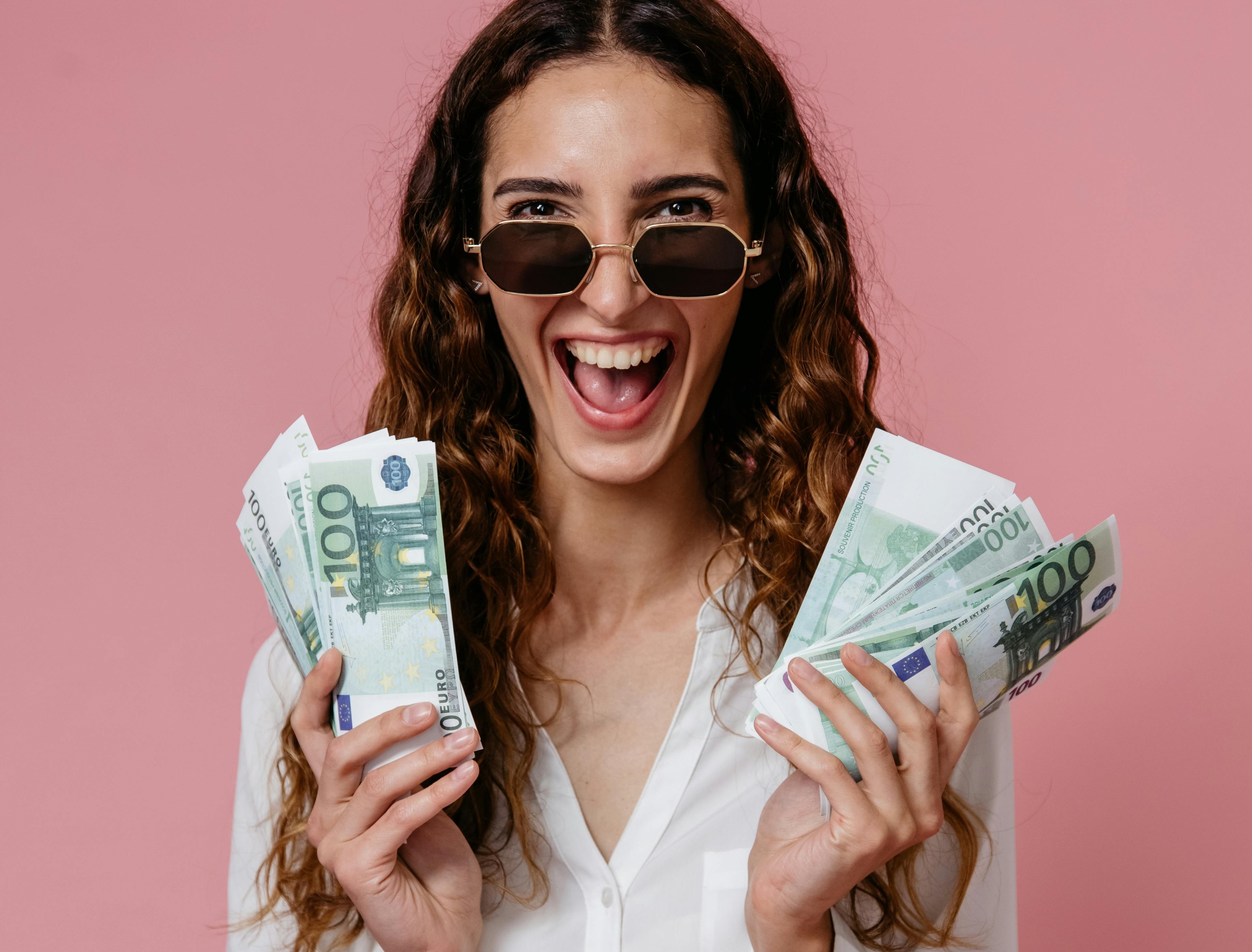 Happy client holding cash